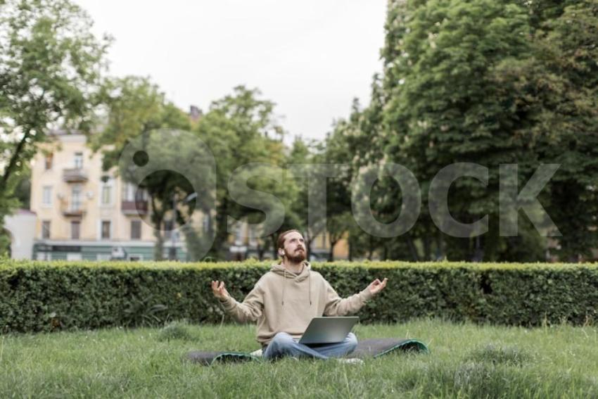Man feeling zen city park with laptop 23 2148573099 jpg