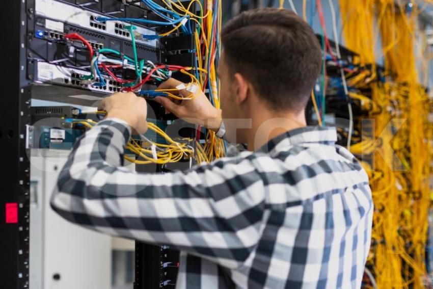 Young man working ethernet switch 23 2148323494 jpg